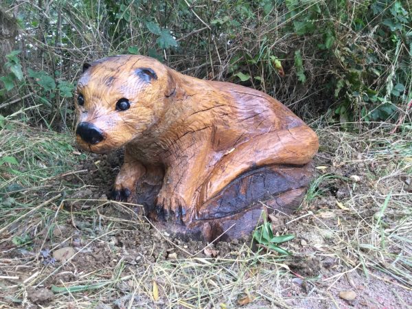 otter carving on ground otter carving on ground